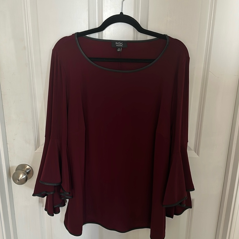 Wine colored blouse 
Trimmed in soft black leather 
Bell sleeves